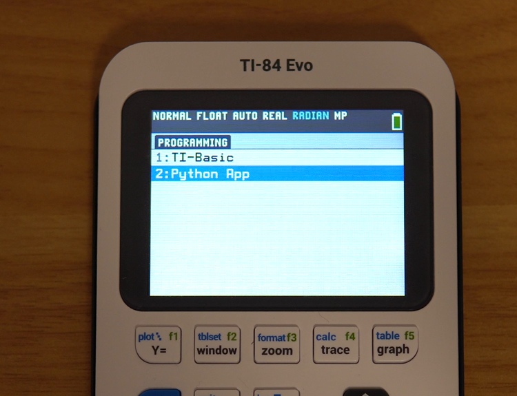 A TI-84 Evo showing the PROGRAMMING menu with 2:Python App restored